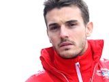 Jules Bianchi of France and Marussia walks across the paddock prior to the Chinese Formula 1 Grand Prix at the Shanghai International Circuit on April 20, 2014