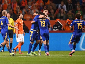 Afellay, RVP spare Netherlands blushes