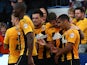 Kwesi Appiah of Cambridge celebrates with team mates after scoring his and the teams second goal of the game during the Sky Bet League Two match against Oxford United on October 11, 2014
