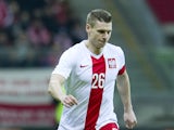 Poland's Lukasz Piszczek controls the ball during international friendly soccer match between Poland and Scotland at the National Stadium on March 5, 2014