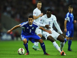 Manuel Battistini of San Marino evades Danny Welbeck of England during the EURO 2016 Group E Qualifying match between England and San Marino at Wembley Stadium on October 9, 2014