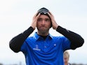 Oliver Wilson of England celebrates on the 18th green after winning the 2014 Alfred Dunhill Links Championship at The Old Course on October 5, 2014
