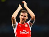 Per Mertesacker of Arsenal celebrates at the end of the UEFA Champions League Qualifier 2nd leg match between Arsenal and Besiktas at the Emirates Stadium on August 27, 2014