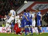 England's defender Phil Jagielka (3rd L) heads the ball to score his team's first goal during a Euro 2016 Qualifier football match between England and San Marino at Wembley Stadium on October 9, 2014