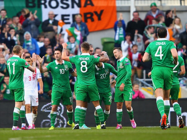 Captain Robbie Keane of Republic of Ireland celebrates with team mates after scoring a goal during the EURO 2016 Qualifier match against Gibraltar on October 11, 2014