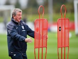 England manager Roy Hodgson looks truly petrified as two metal silhouettes attack him at St George's Park on October 8, 2014