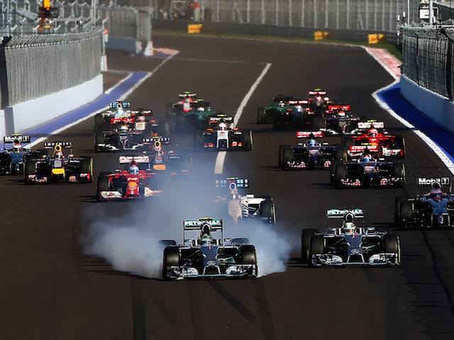 Nico Rosberg of Germany and Mercedes GP locks up approaching turn two next to Lewis Hamilton of Great Britain and Mercedes GP during the Russian Formula 1 Grand Prix at Sochi Autodrom on October 12, 2014