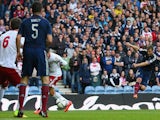 Shaun Maloney of Scotland fires in a shot which goes in off Akaki Khubutia of Georgia for an own goal to open the scoring during the EURO 2016 Qualifier match on October 11, 2014