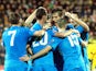 Slovenia's forward Milivoje Novakovic (2nd L) celebrates with his teammates after scoring during the Euro 2016 Group E qualifying football match Lithuania vs Slovenia in Kaunas, Lithuania on October 12, 2014