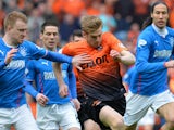 Steven Smith of Rangers chases down Stuart Armstrong of Dundee United during the William Hill Scottish Cup Semi Final between Rangers and Dundee United at Ibrox Stadium on April 12, 2014