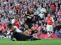 Arsenal's English striker Danny Welbeck scores their second goal past Hull City's English defender Curtis Davies and Hull City's Egyptian midfielder Ahmed Elmohamady during their English Premier League football match against Hull City at the Emirates Stad