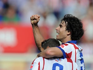 Tiago Mendes of Club Atletico de Madrid celebrates after scoring his team's opening goal during the La Liga match between Club Atletico de Madrid and RCD Espanyol at Vicente Calderon Stadium on October 19, 2014