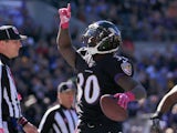 Running back Bernard Pierce #30 of the Baltimore Ravens celebrates after scoring a touchdown in the second quarter of a game against the Atlanta Falcons at M&T Bank Stadium on October 19, 2014