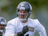 Defensive end Cassius Marsh #91 of the Seattle Seahawks defends during Rookie Minicamp at the Virginia Mason Athletic Center on May 17, 2014