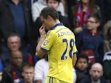Chelsea's Spanish defender Cesar Azpilicueta leaves the pitch after being shows the red card during the English Premier League football match between Crystal Palace and Chelsea at Selhurst Park in south London on October 18, 2014