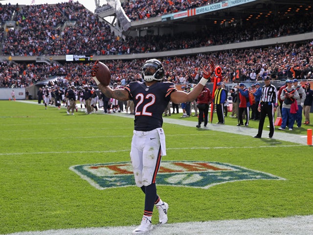 Matt Forte #22 of the Chicago Bears celebrates his third-quarter touchdown during a game against the Miami Dolphins at Soldier Field on October 19, 2014