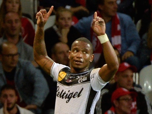 Guingamp's French midfielder Claudio Beauvue celebrates after scoring during their French L1 football match Lille vs Guingamp on October 18, 2014 
