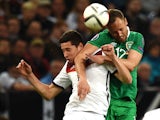 Germany's midfielder Julian Draxler and Ireland 's David Meyler vie for the ball during the UEFA Euro 2016 Group D qualifying football match Germany vs Republic of Ireland in Gelsenkirchen, western Germany on October 14, 2014