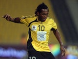 Former Aston Villa player Eric Djemba-Djemba of Cameroon now playing at Qatar club runs with the ball during their Qatari championship football match against al-Khor club in Doha 20 September 2007