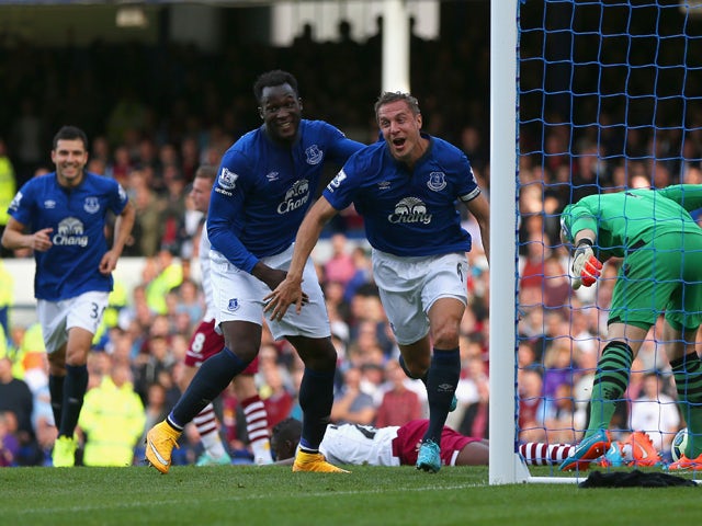 Phil Jagielka of Everton turns to celebrate after scoring the opening goal during the Barclays Premier League match between Everton and Aston Villa at Goodison Park on October 18, 2014