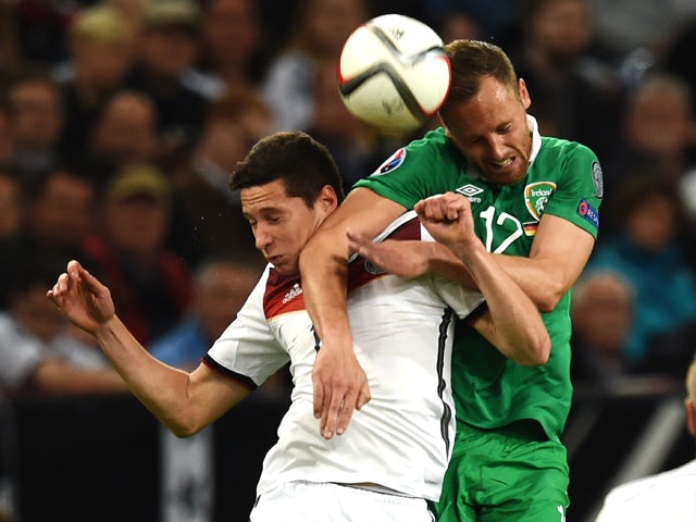 Germany's midfielder Julian Draxler (L) and Ireland 's David Meyler vie for the ball during the UEFA Euro 2016 Group D qualifying football match Germany vs Republic of Ireland in Gelsenkirchen, western Germany on October 14, 2014