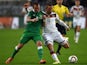 Germany's forward Lukas Podolski and Ireland 's Glenn Whelan vie for the ball during the UEFA Euro 2016 Group D qualifying football match Germany vs Republic of Ireland in Gelsenkirchen, western Germany on October 14, 2014