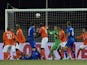 Iceland's midfielder Gylfi Thor Sigurdsson (down) scores duirng the Euro 2016 Group A qualifying football match Iceland vs the Netherlands in Reykjavik, Iceland on October 13, 2014