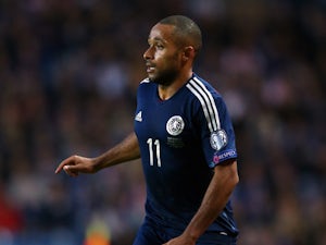 Ikechi Anya of Scotland runs with the ball during the EURO 2016 Qualifier match between Scotland and Georgia at Ibrox Stadium on October 11, 2014