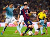 Lionel Messi of FC Barcelona duels for the ball with SD Eibar players during the La Liga match between FC Barcelona and SD Eibar at Camp Nou on October 18, 2014