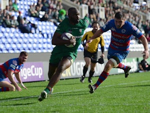 Stefan Basson of Rovigo fails to stop Topsy Ojo of London Irish from scoring a try during the European Rugby Challenge Cup match between London Irish and Rovigo at Madejski Stadium on October 19, 2014