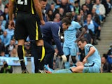 Manchester City's English midfielder Frank Lampard lies injured during the English Premier League football match between Manchester City and Tottenham Hotspur at the The Etihad Stadium in Manchester, north west England on October 18, 2014