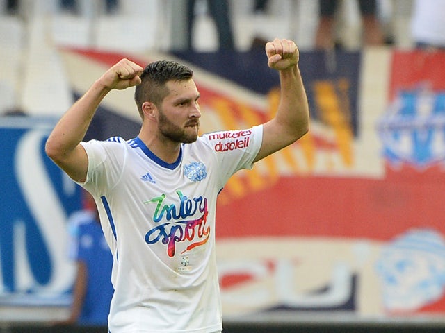 Marseille's French forward Andre-Pierre Gignac celebrates after the second goal during their French L1 football match Olympique de Marseille (OM) versus Toulouse at the Velodrome stadium in Marseille, on October 19, 2014