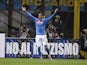 Napoli's midfielder from Spain Juan Miguel Callejon celebrates after scoring during the Italian Serie A football match Inter Milan vs Naples on October 19, 2014