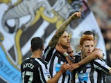 Newcastle player Gabriel Obertan celebrates his goal with team mates during the Barclays Premier League match between Newcastle United and Leicester City at St James' Park on October 18, 2014