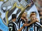 Newcastle player Gabriel Obertan celebrates his goal with team mates during the Barclays Premier League match between Newcastle United and Leicester City at St James' Park on October 18, 2014