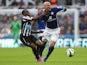 Leicester City's Argentinian midfielder Esteban Cambiasso vies with Newcastle United's Dutch midfielder Vurnon Anita during the English Premier League football match between Newcastle United and Leicester City at St James' Park in Newcastle-upon-Tyne, nor