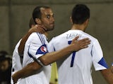 Israel's forward Omer Damari (L) celebrates with teammates after scoring a goal during the Euro 2016 group D qualifying football match between Andorra on October 13, 2014