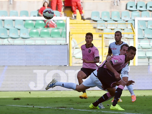 Paulo Dybala of Palermo scores the opening goal during the Serie A match between US Citta di Palermo and AC Cesena at Stadio Renzo Barbera on October 19, 2014
