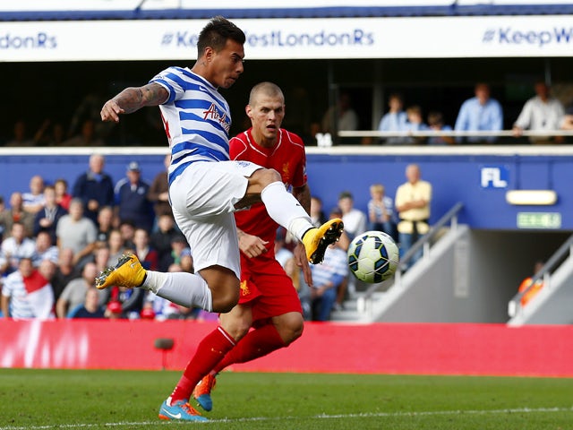 Eduardo Vargas of QPR scores his team's first goal during the Barclays Premier League match between Queens Park Rangers and Liverpool at Loftus Road on October 19, 2014
