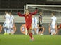 Romania's Vlad Chiriches celebrates the 0-1 goal by team mate Bogdan Stancu during the UEFA Euro 2016 Group F qualifying football match Finland vs Romania in Helsinki, Finland on October 14, 2014