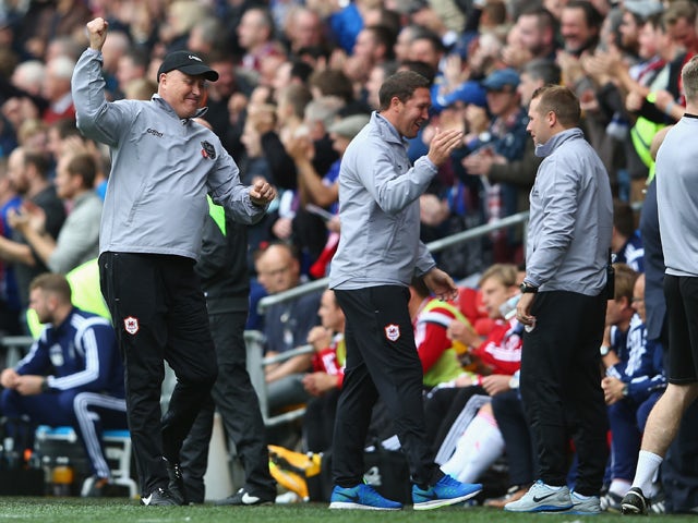 Russell Slade the new manager of Cardiff City celebrates his sides first goal during the Sky Bet Championship match between Cardiff City and Nottingham Forest at Cardiff City Stadium on October 18, 2014