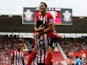 Dusan Tadic and Graziano Pelle of Southampton celebrate during the Barclays Premier League match between Southampton and Sunderland at St Mary's Stadium on October 18, 2014
