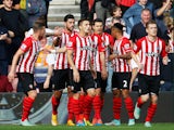 Graziano Pelle of Southampton celebrates with team mates as he scores their second goal during the Barclays Premier League match between Southampton and Sunderland at St Mary's Stadium on October 18, 2014