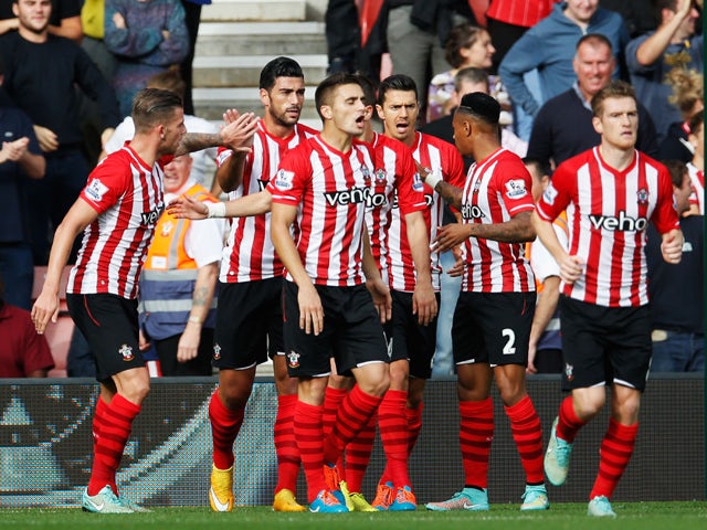 Graziano Pelle of Southampton celebrates with team mates as he scores their second goal during the Barclays Premier League match between Southampton and Sunderland at St Mary's Stadium on October 18, 2014