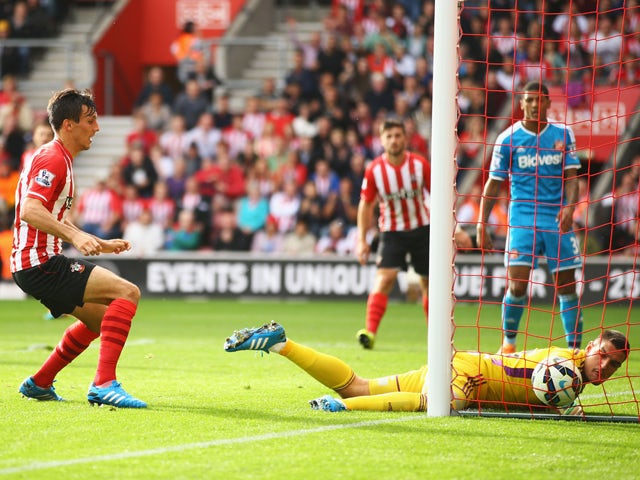 Jack Cork of Southampton beats Vito Mannone of Sunderland to score their third goal during the Barclays Premier League match between Southampton and Sunderland at St Mary's Stadium on October 18, 2014