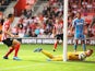 Jack Cork of Southampton beats Vito Mannone of Sunderland to score their third goal during the Barclays Premier League match between Southampton and Sunderland at St Mary's Stadium on October 18, 2014