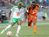 Lorient's French Togolese forward Gilles Sunu challenges Saint-Etienne's French forward Allan Saint-Maximin during the French L1 football match between Lorient and Saint-Etienne at the Moustoir stadium in Lorient, western France, on October 18, 2014