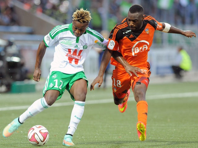 Lorient's French Togolese forward Gilles Sunu challenges Saint-Etienne's French forward Allan Saint-Maximin during the French L1 football match between Lorient and Saint-Etienne at the Moustoir stadium in Lorient, western France, on October 18, 2014