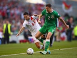 Ryan Casciaro of Gibraltar and Stephen Ward of Republic of Ireland battle for the ball during the EURO 2016 Qualifier match between Republic of Ireland and Gibraltar at Aviva Stadium on October 11, 2014