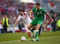 Ryan Casciaro of Gibraltar and Stephen Ward of Republic of Ireland battle for the ball during the EURO 2016 Qualifier match between Republic of Ireland and Gibraltar at Aviva Stadium on October 11, 2014
